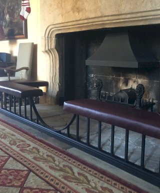 Fireplace surround incorporating seating
